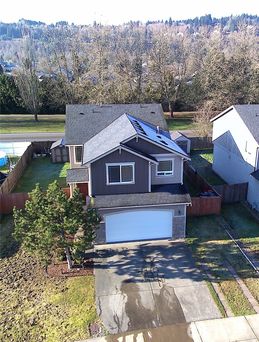 a aerial view of a house with a yard