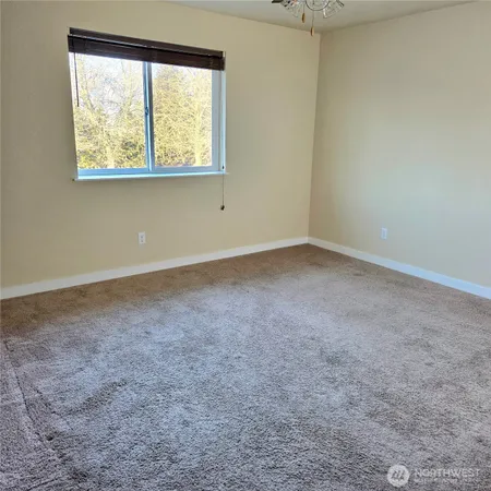 an empty room with closet area