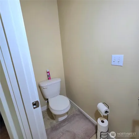 a view of walk in closet with clothes