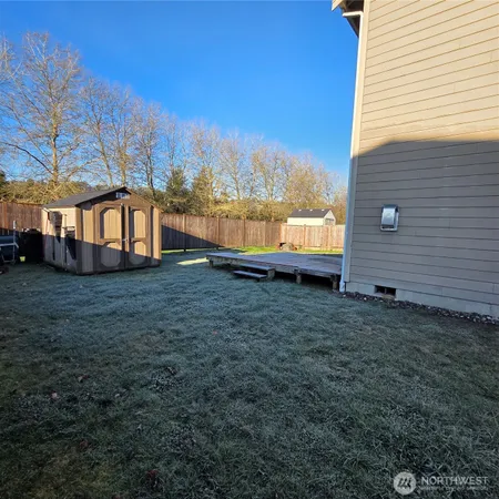 a backyard of a house with lots of green space