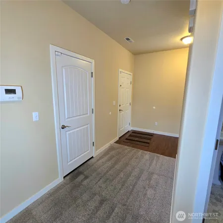 a view of bathroom with a toilet sink and mirror