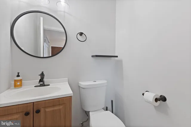 a kitchen with granite countertop a sink a counter space stainless steel appliances and cabinets