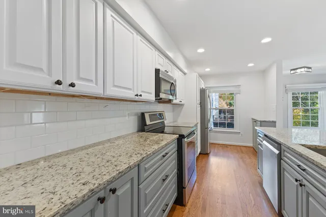 a kitchen with a sink and a stove