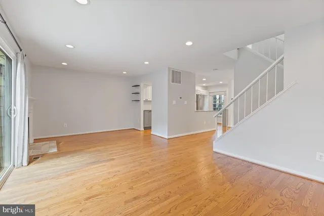 a view of an empty room with a fireplace