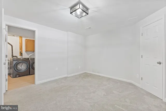 a backyard of a house with wooden fence