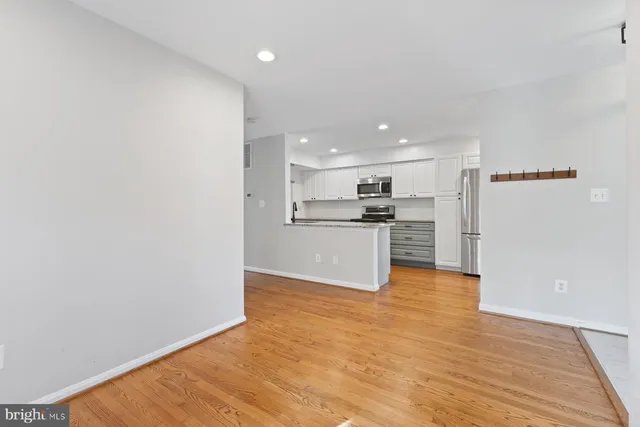 a view of kitchen with wooden floor