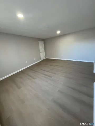 an empty room with a bench