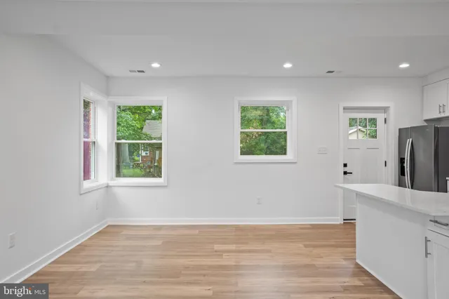 a view of a kitchen with furniture and a window