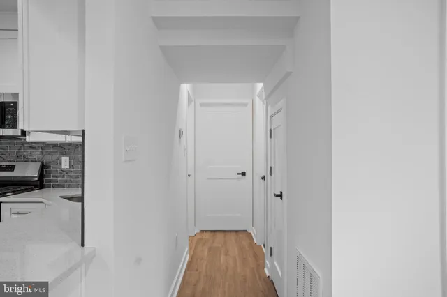 a view of a hallway with a fireplace