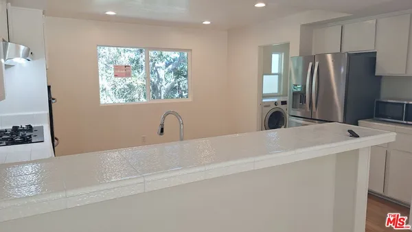a bathroom with a bathtub and a sink
