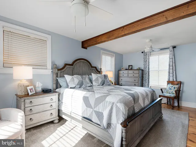 a bedroom with bed and window