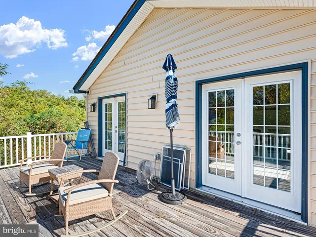 a view of a patio with a table and chairs
