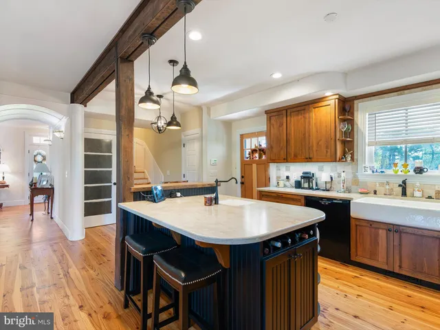 a kitchen with a table and chairs in it