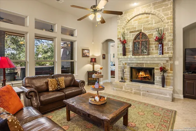 a living room with furniture and a fireplace