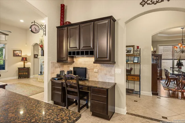 a kitchen with stainless steel appliances a stove and cabinets