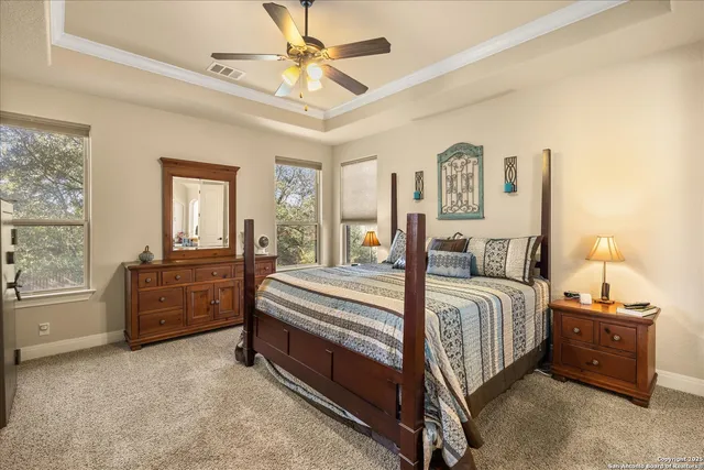 a bed room with a bed and a chandelier