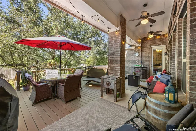 a outdoor living space with furniture and a fireplace
