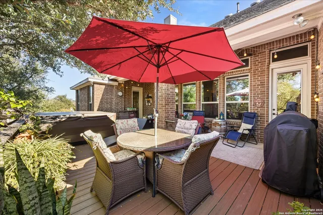 a view of balcony with outdoor seating and wooden floor