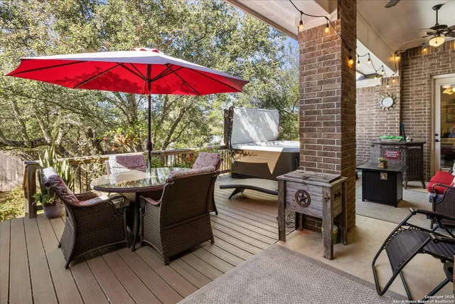 a view of backyard with seating space and trees