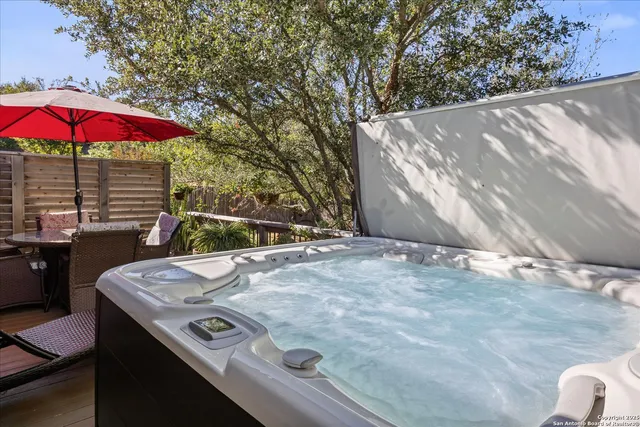 a view of a balcony with furniture and wooden floor