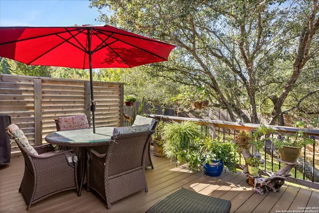 a backyard of a house with a yard and outdoor seating