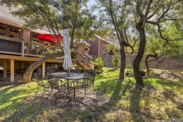 a view of a house with yard and sitting area