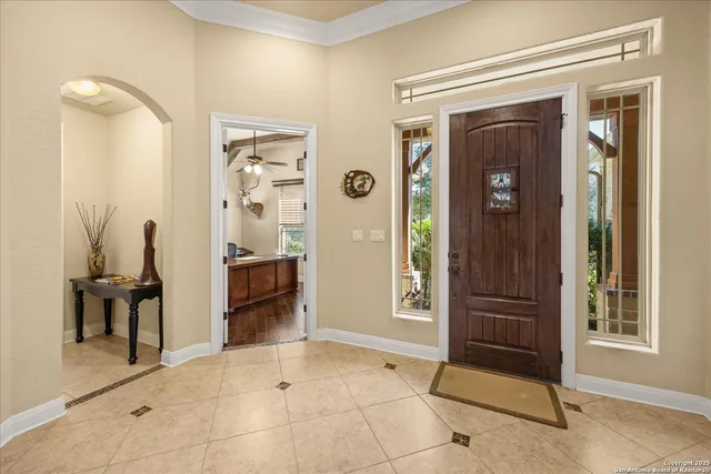a view of a hallway with dining area and glass door