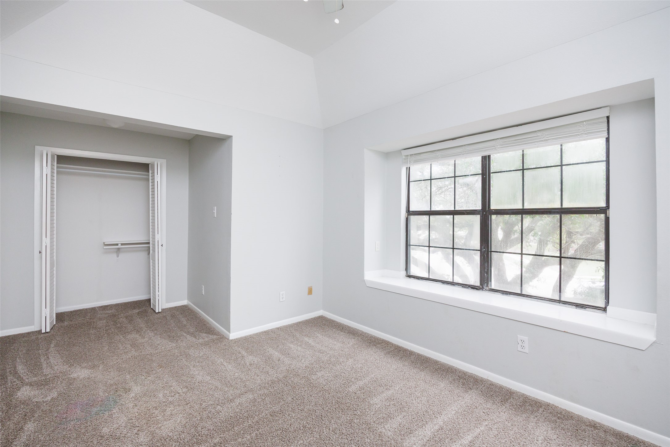 320 Long Point Drive Portland, TX 78374 - Photo 11 of 40 Vaulted ceiling room featuring a large window with gridded panes and a deep sill