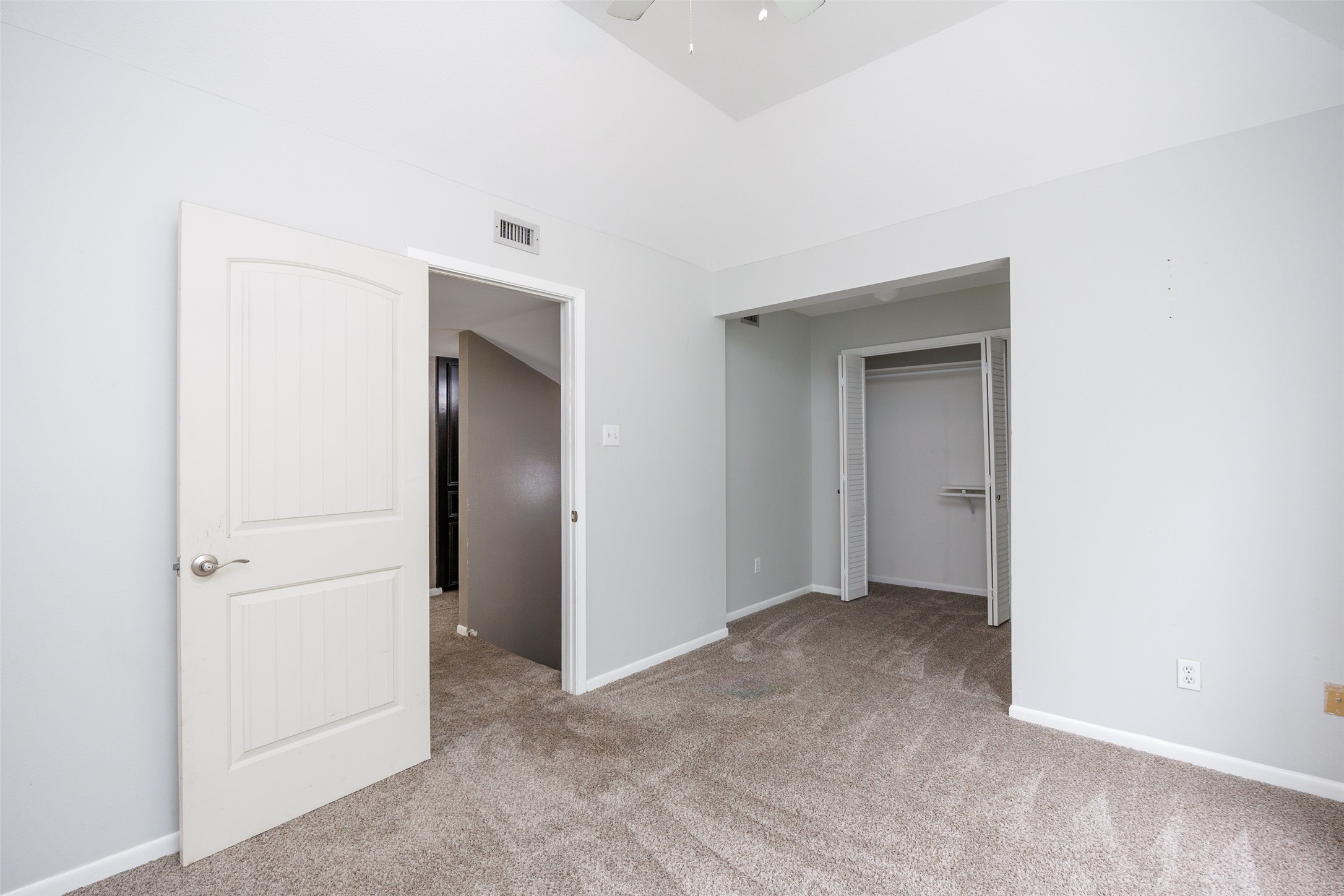 320 Long Point Drive Portland, TX 78374 - Photo 12 of 40 Carpeted room featuring light gray walls and a vaulted ceiling