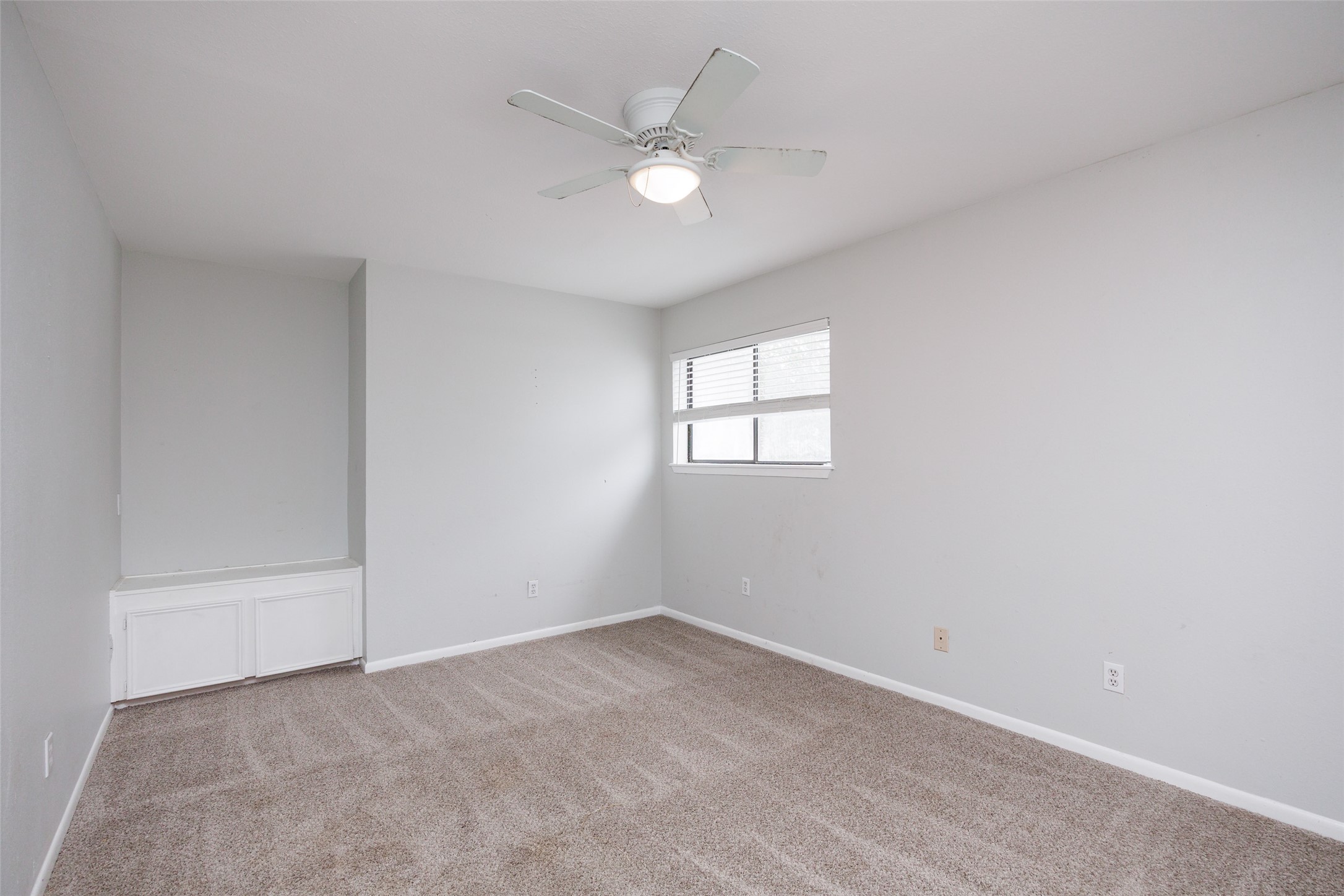 320 Long Point Drive Portland, TX 78374 - Photo 16 of 40 Neutral-toned room featuring light gray walls, carpet flooring, and a window with horizontal blinds