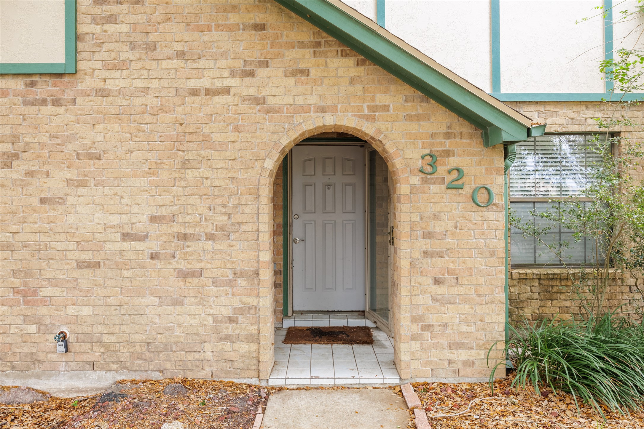 320 Long Point Drive Portland, TX 78374 - Photo 2 of 40 A charming arched brick alcove creates a sheltered and welcoming first impression as you step toward the front door.