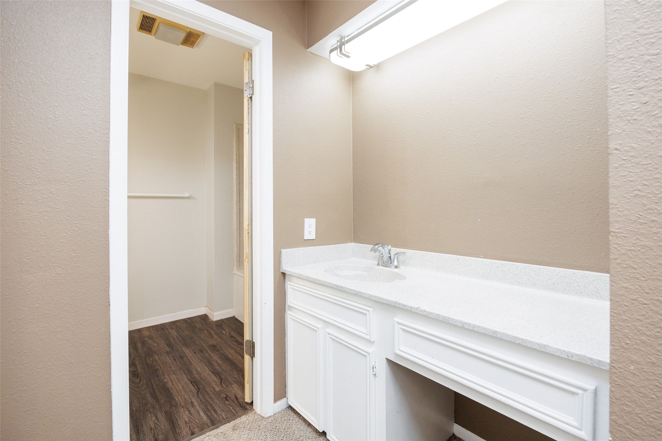 320 Long Point Drive Portland, TX 78374 - Photo 22 of 40 Bathroom vanity featuring a white countertop with integrated sink and chrome faucet