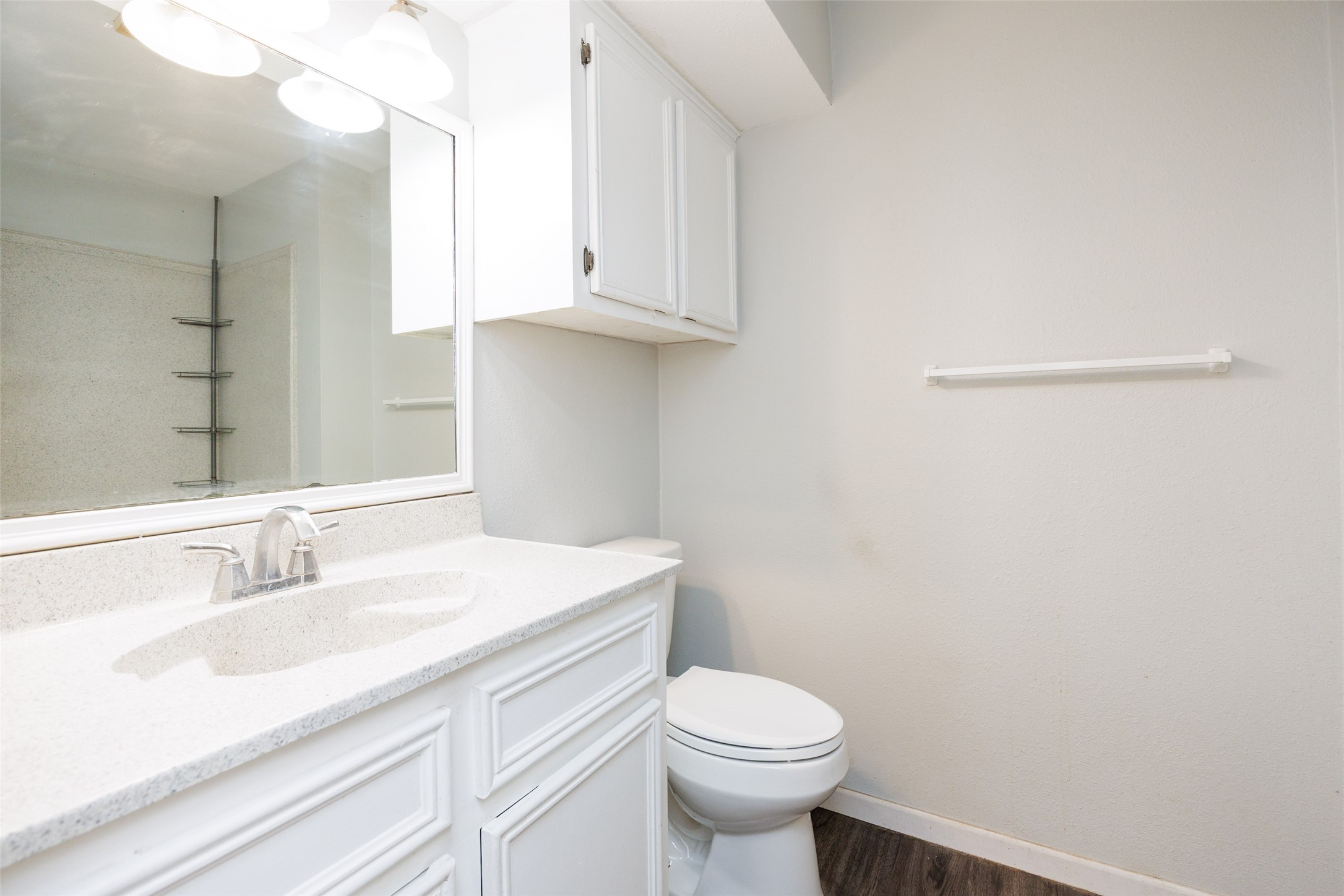 320 Long Point Drive Portland, TX 78374 - Photo 23 of 40 Bathroom vanity featuring a speckled countertop, undermount sink, and chrome-finish faucet
