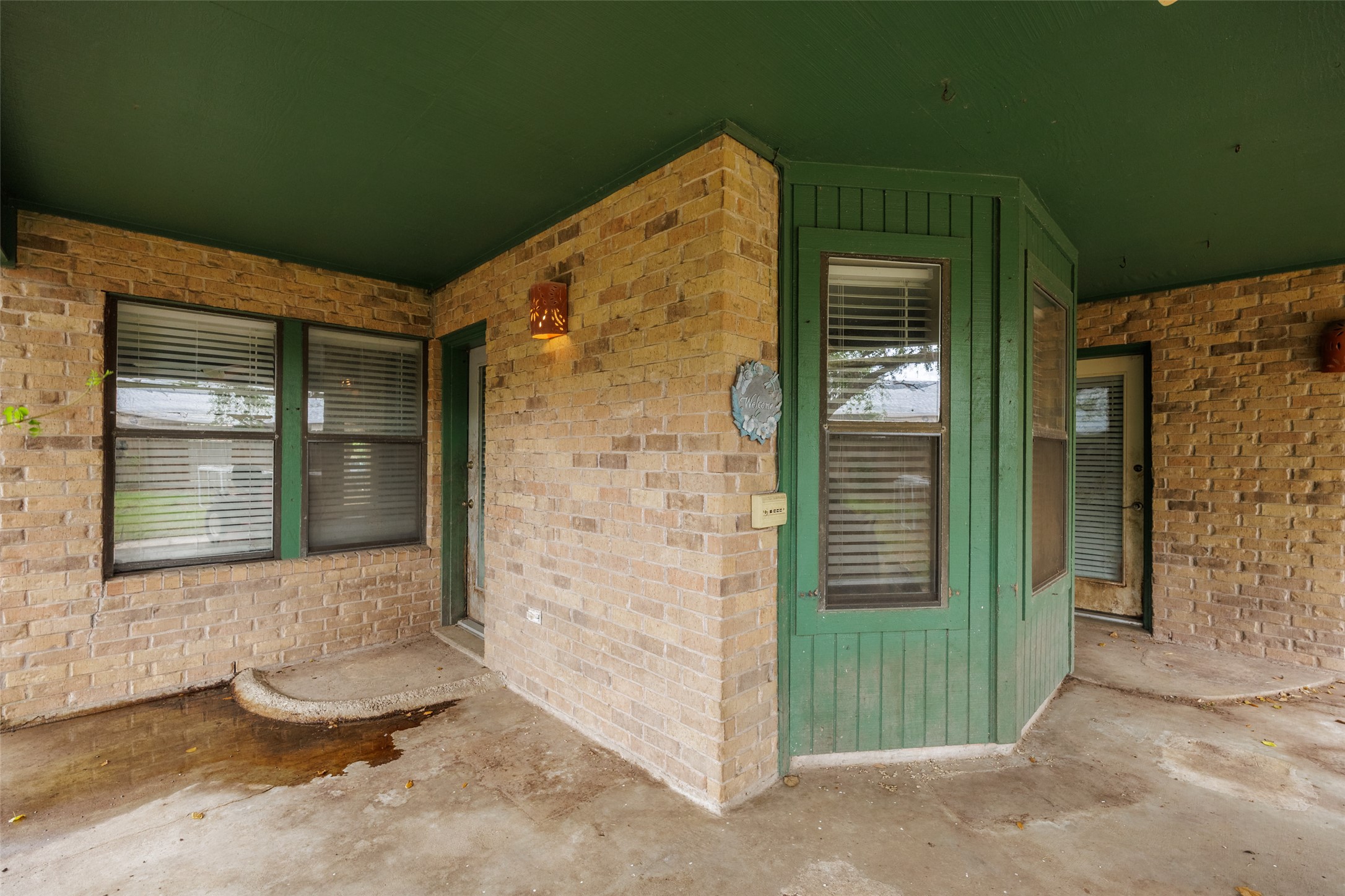 320 Long Point Drive Portland, TX 78374 - Photo 34 of 40 Covered outdoor patio featuring brick siding and green trim