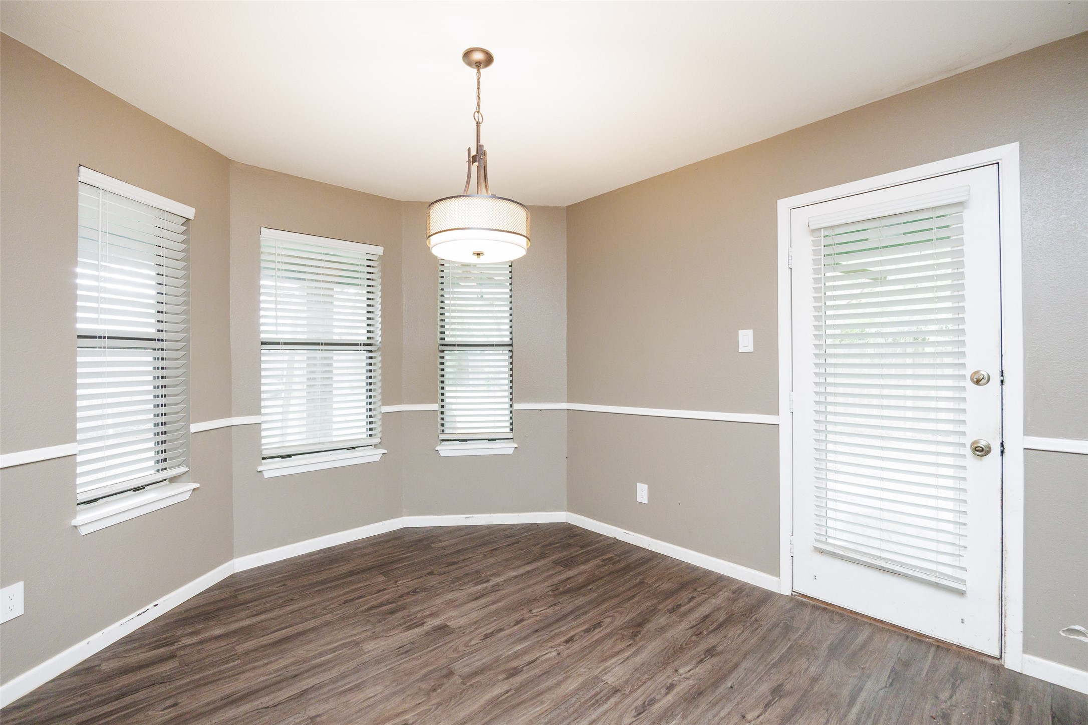 320 Long Point Drive Portland, TX 78374 - Photo 8 of 40 The sun-filled dining area features a charming bay window and provides direct access to the backyard, making it an ideal spot for morning coffee or casual meals.