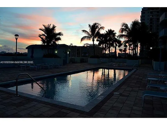 a view of swimming pool with a patio