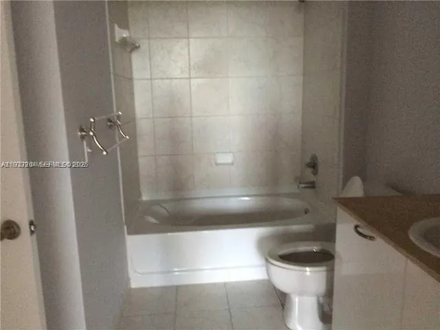 a bathroom with a shower and a toilet