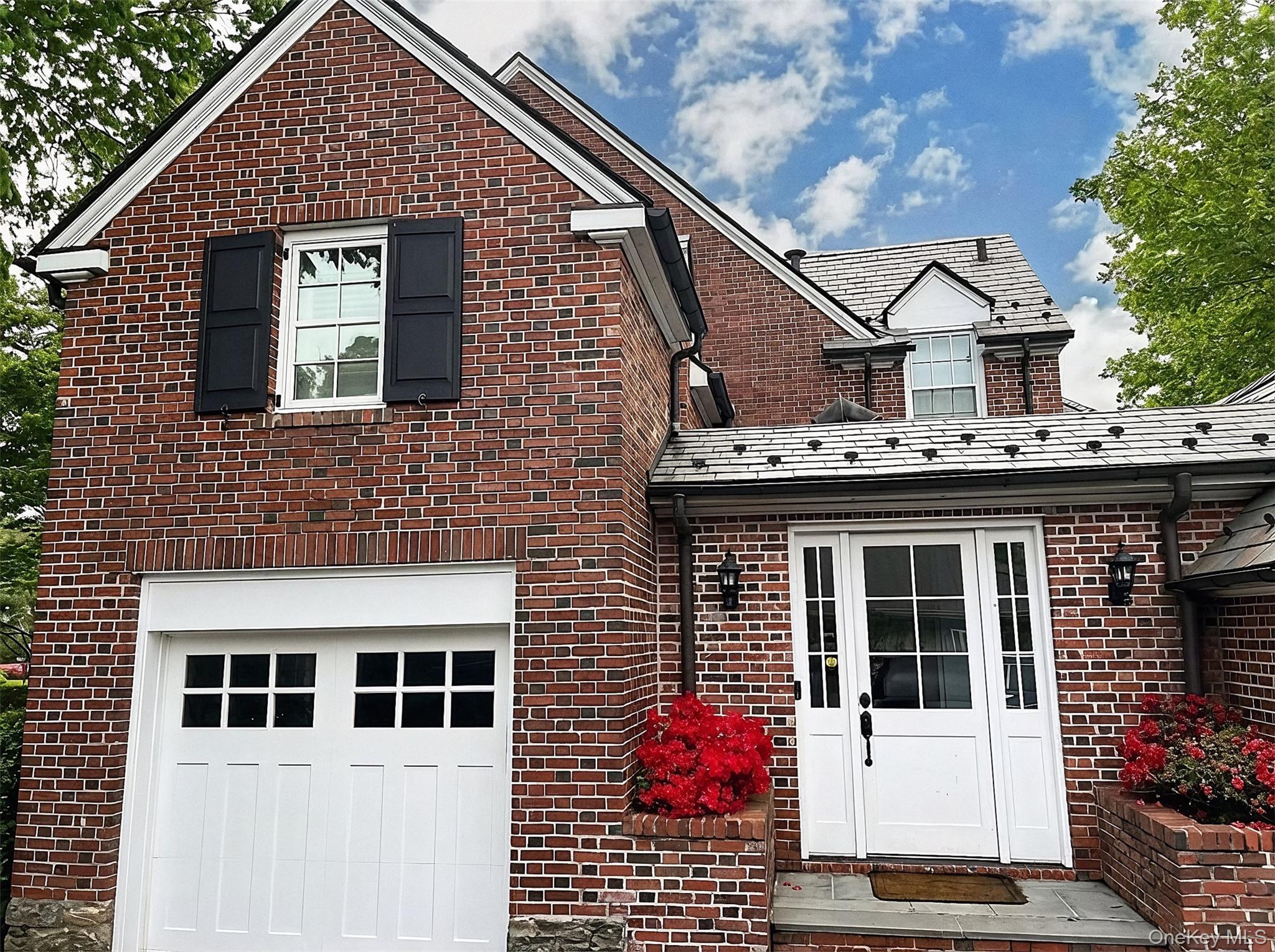 41 Sturgis Road Bronxville, NY 10708 - Photo 3 of 8 a front view of a house with a yard