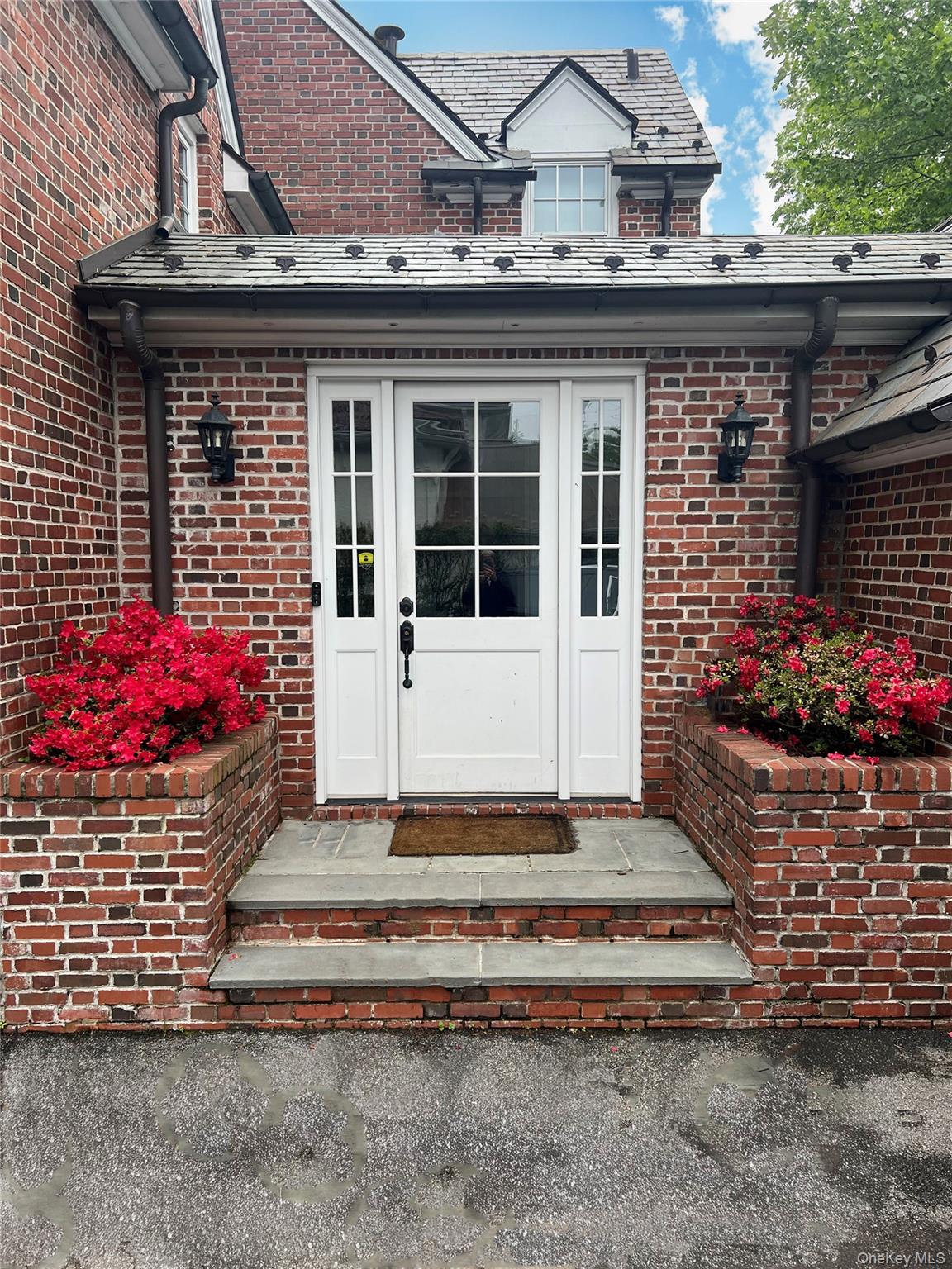 41 Sturgis Road Bronxville, NY 10708 - Photo 4 of 8 a front view of a house with a yard