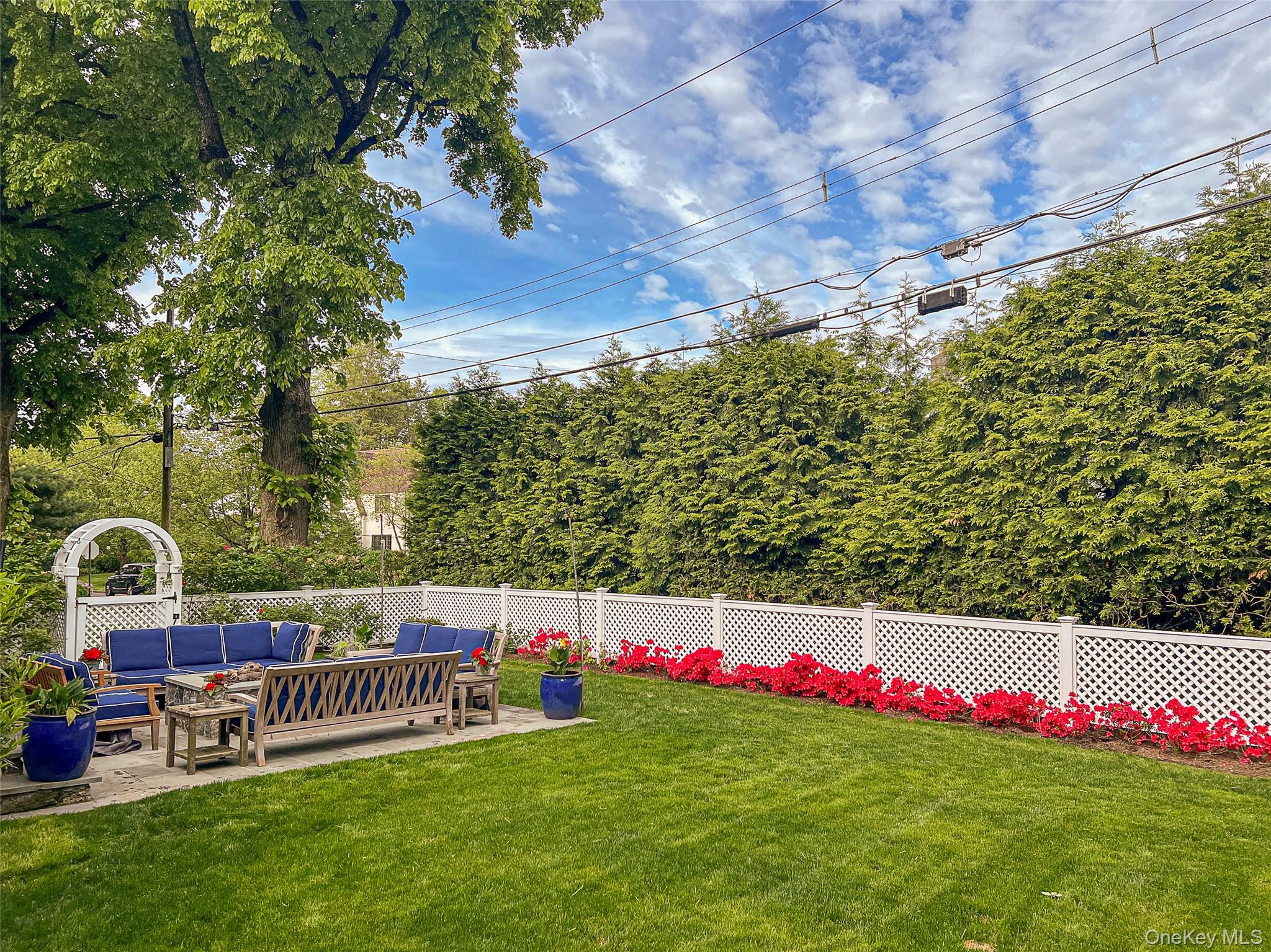 41 Sturgis Road Bronxville, NY 10708 - Photo 5 of 8 a view of swimming pool with sitting area and garden