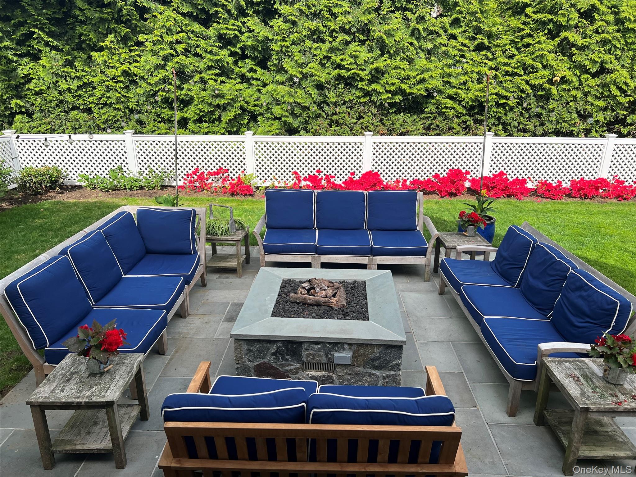 41 Sturgis Road Bronxville, NY 10708 - Photo 6 of 8 a view of a chairs and table in the back yard of the house