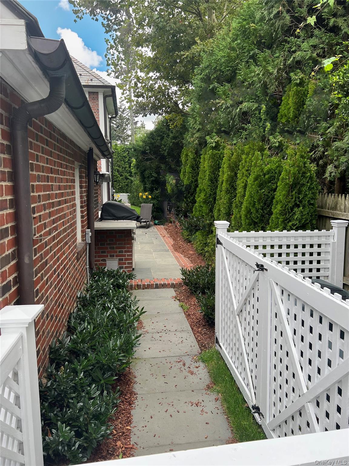 41 Sturgis Road Bronxville, NY 10708 - Photo 8 of 8 a view of a pathway with a wrought fence