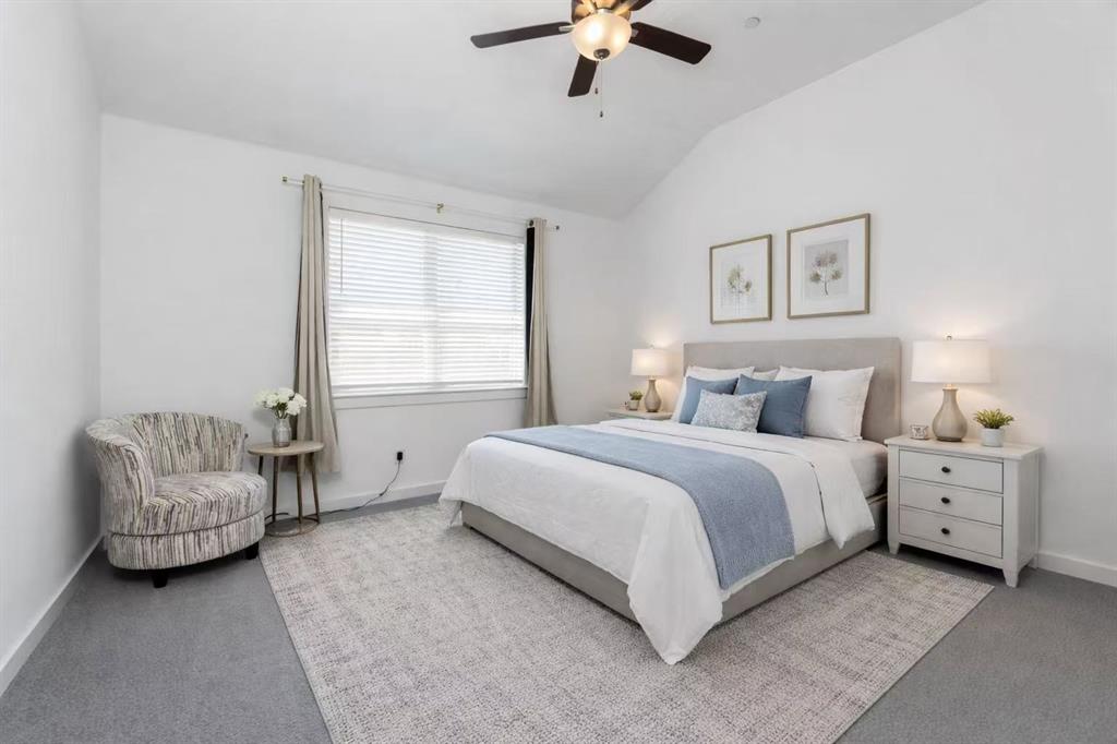 631 Cobblestone Lane Irving, TX 75039 - Photo 20 of 32 a spacious bedroom with a bed and a couch