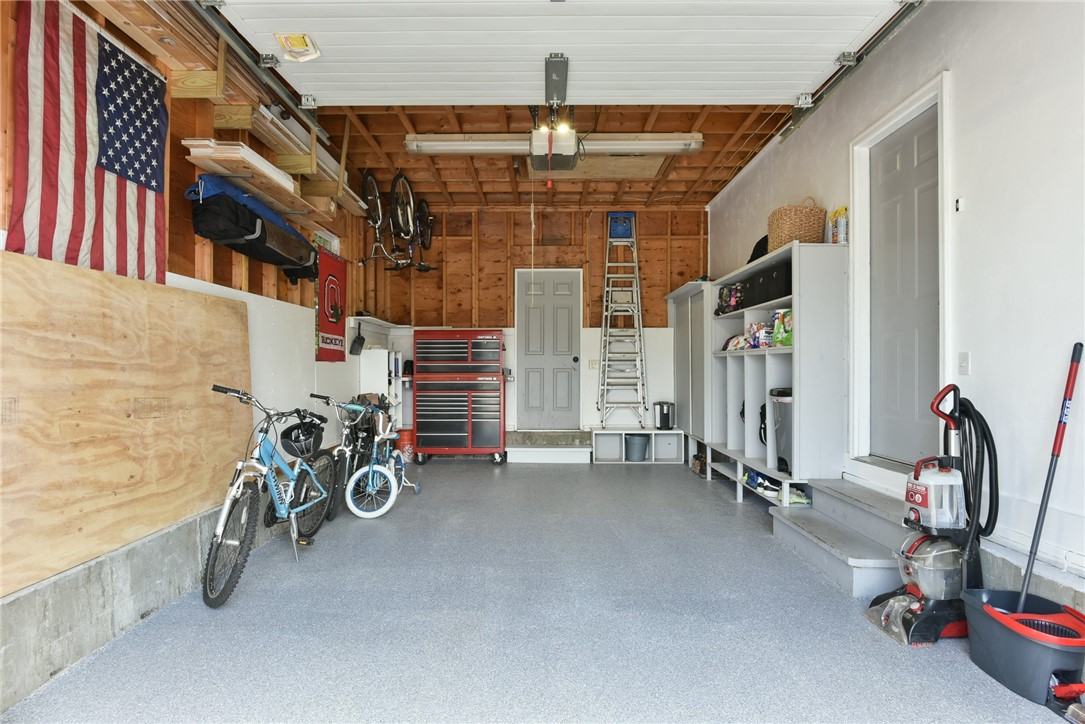 48 Kickemuit Road Warren, RI 02885 - Photo 16 of 32 Immaculate garage with a pulldown hatch with ladder for storage above.