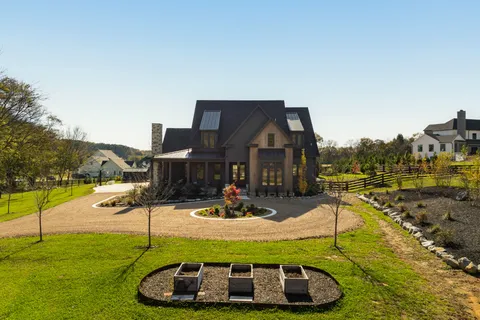 a living room with furniture potted plant and a fireplace