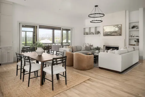 a white stove top oven sitting inside of a kitchen