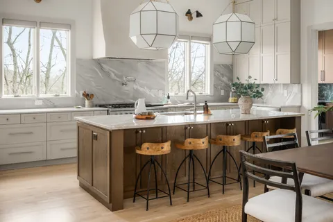 a bed room with a bed and a large window