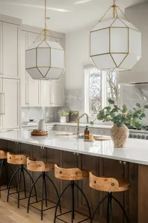 a kitchen with stainless steel appliances a sink stove and cabinets