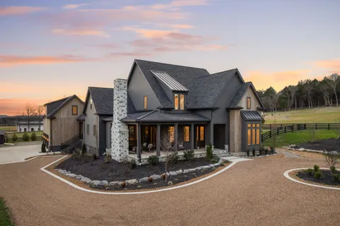 a front view of house and yard with green space