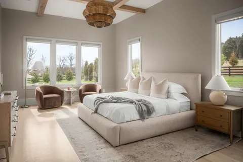 a view of swimming pool with outdoor seating and trees in the background